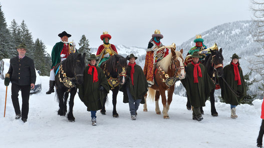 Austria Carol Singers Locals dressed as traditional carol singers ride on horses on Monday, Jan. 5, 2015 in Dienten, Austrian province of Salzburg. Traditionally carol singers walk from house to house around epiphany to collect money for poor children in other countries. (AP Photo/Kerstin Joensson)